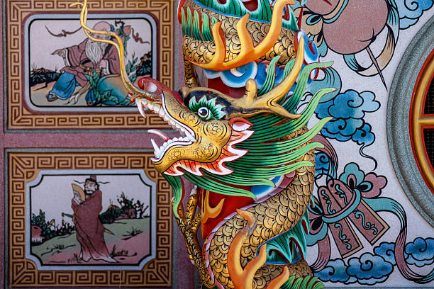 istock Dragon sculpture on  pillar within a Chinese shrine. 2255350316