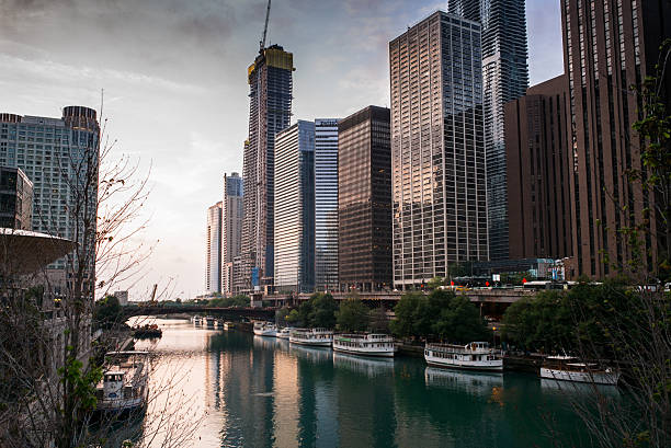 Chicago, USA - April 13, 2025: Chicago River flowing through urban cityscape with iconic architecture and a bridge