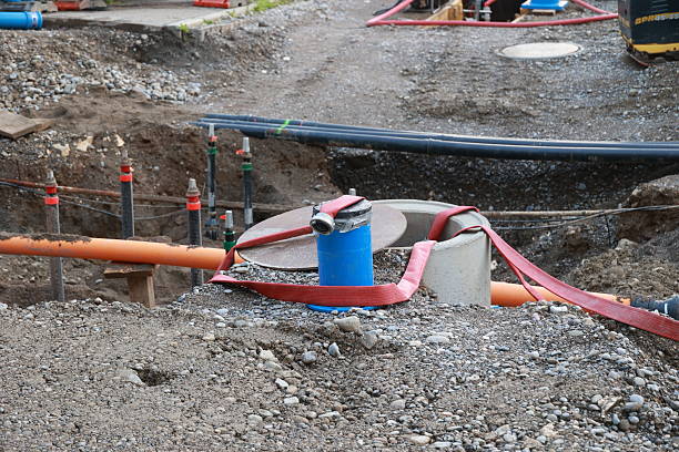 istock Blue and red pipe is tied to a cement block 2255351281