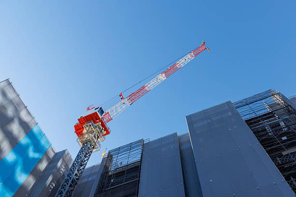 istock Large construction crane reaching high into the blue sky 2255353954