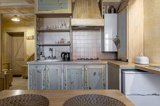 Home interior of kitchen countertop, kitchen utensil and shelf on the wall. Indoors architecture.
