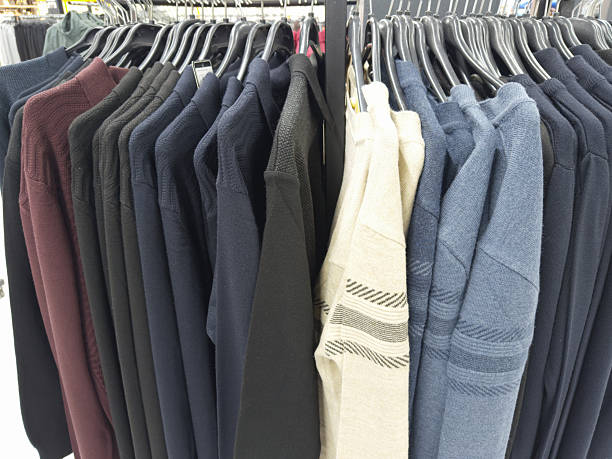 A row of colored t-shirts in the store