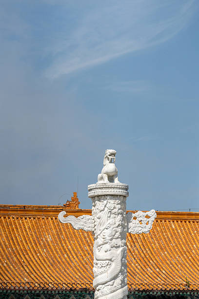 Ornamental column in front of a Chinese palaceThe traditional Chinese palace architecture of the New Yuanmingyuan in Zhuhai Zhuhai City, Guangdong Province