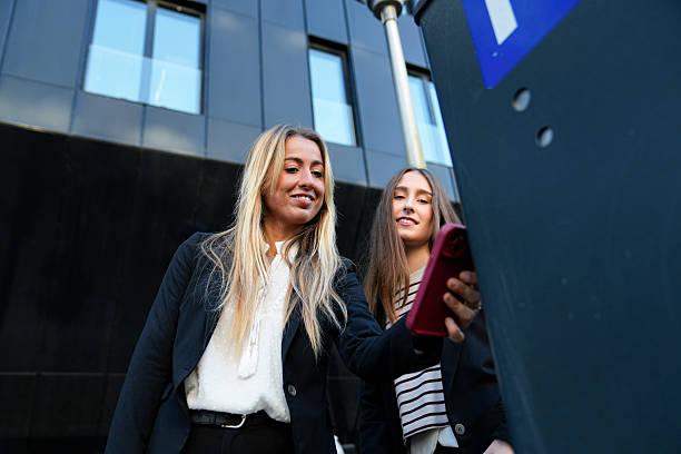 istock Young women using mobile application for urban parking payment 2255372740