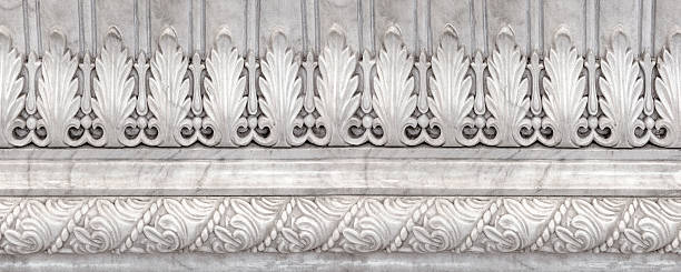 White marble carving showing intricate classical architectural details and decorative patterns