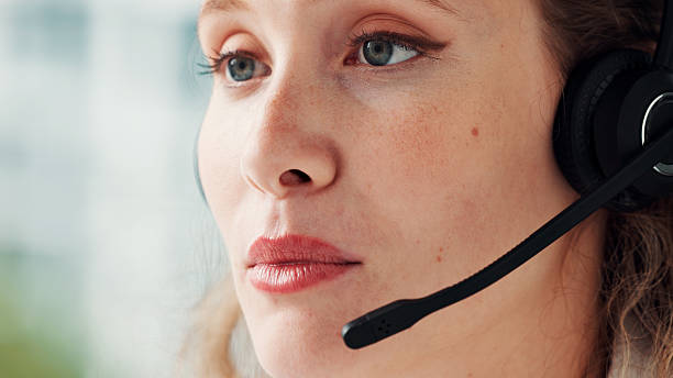 istock Call center, headset and woman in office, help desk and communication with system solution. Person, employee and agent in workplace, advice and contact us with customer service, support or connection 2255384301