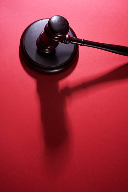 top view of gavel hammer against red background