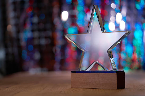 istock crystal star shape trophy against bokeh light as background 2255387772