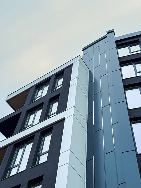 istock Modern architecture stands tall against a muted sky, showcasing sleek lines and contrasting colors in an urban landscape 2255390677