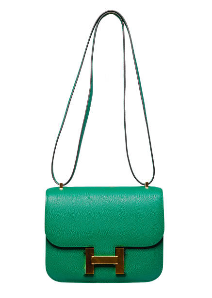 istock Luxury green leather shoulder bag with gold hardware isolated on white background 2255390723