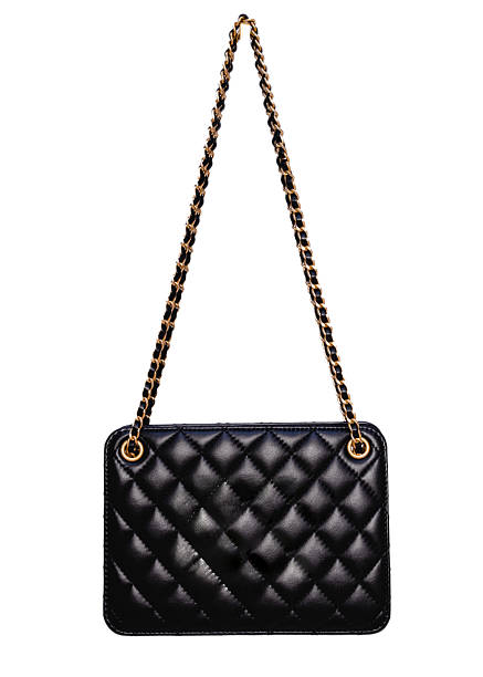 istock Luxury black quilted leather shoulder bag with gold chain strap isolated on white background 2255390726