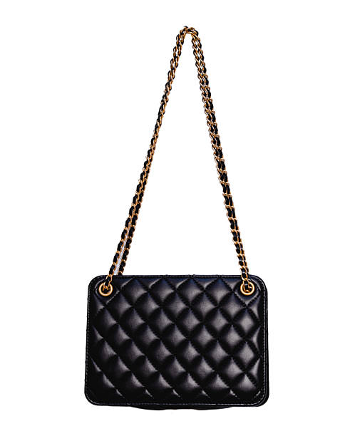 istock Luxury black quilted leather shoulder bag with gold chain strap isolated on white background 2255390736