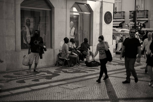 Lisbon, Portugal - November 2, 2024: Street musicians perform at the Rua Augusta street in Lisbon downtown.