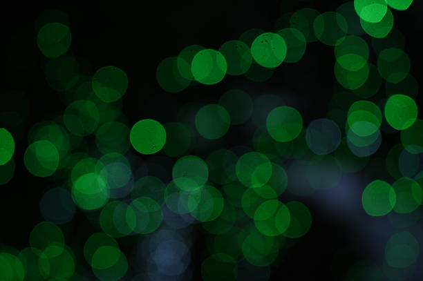 Green bokeh lights on a black background