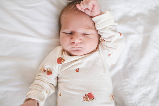 istock nice Little newborn boy lay on bedroom 2255393989