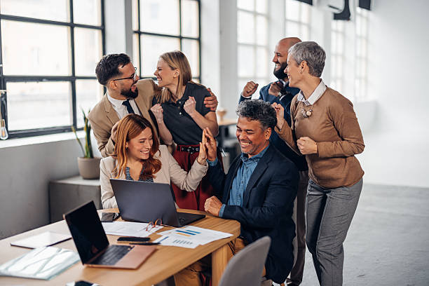 istock Joyful Office Team Celebrating Success Together 2255401928