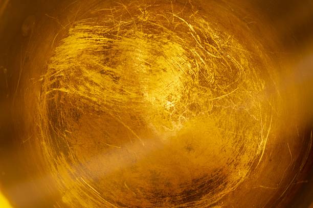 This image presents a captivating golden backdrop perfect for adding elegance and sophistication to any creative endeavor