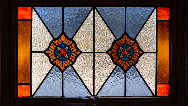 istock Stained glass window with intricate patterns and vibrant colors 2255404143