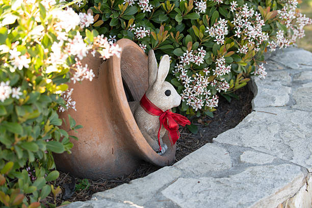 Rabbit easter garden decor. Rabbit cute holiday decoration. Rabbit spring festive symbol. Rabbit playful seasonal ornament