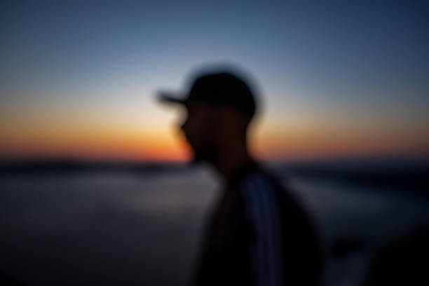 An abstract portrait captured at dusk in Santorini, with soft tones and out-of-focus rendering for a dreamy, contemplative effect.