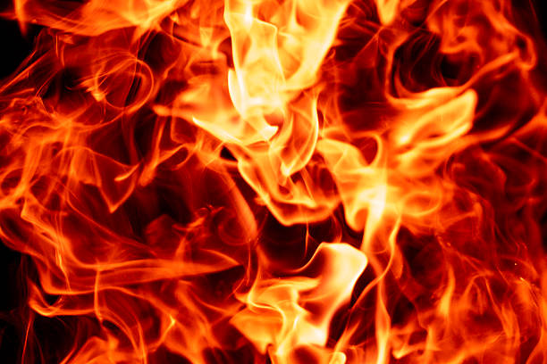 Fire flames on black. Fire inferno. Fire sparks. Fire glowing effect