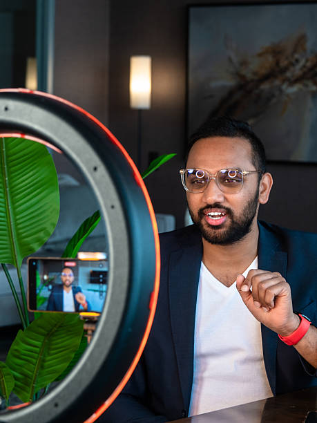 istock Man speaking on video call in a modern office 2255408692