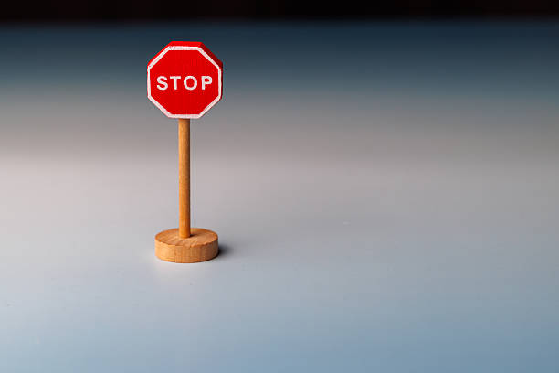 istock Conceptual shot of a wooden STOP sign on a gradient background representing self control and the cessation of toxic behaviors today. 2255408781