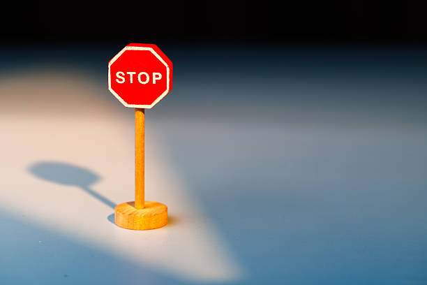 istock Wooden STOP sign on a gradient background for conceptual imagery about behavior modification and stopping harmful personal practices. 2255409019