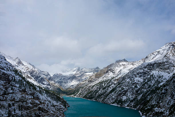 Kölnbrein Dam and the Koelnbreinspeicher reservoir in the Maltatal Carinthia Austria during an overcast springtime day in the Hohe Tauern range in the Alps.