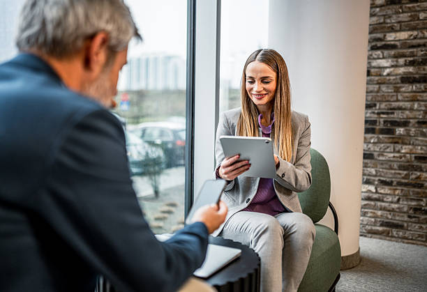 istock Business people collaborating with digital tablets at office 2255411318