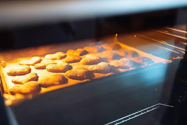 Heart-shaped gingerbread cookies are baked in the oven