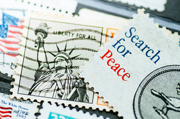 Detail of a vintage United States postage stamp with peace-related imagery and handwritten postal marks. Concept of peace, communication, and postal history.