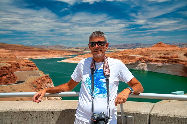 A man visiting Glen Canyon Dam Bridge.
