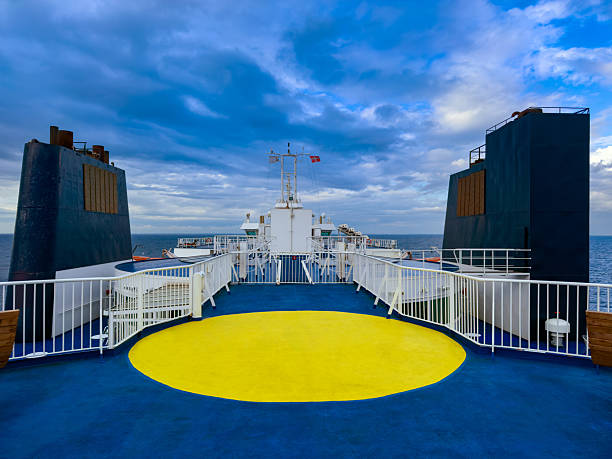 Puttgarden Rodby ferry deck on cloudy day over Baltic Sea, Germany to Denmark, no people.