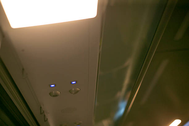 istock Train ceiling details, Inspector looks at train ceiling panels and controls 2255439746