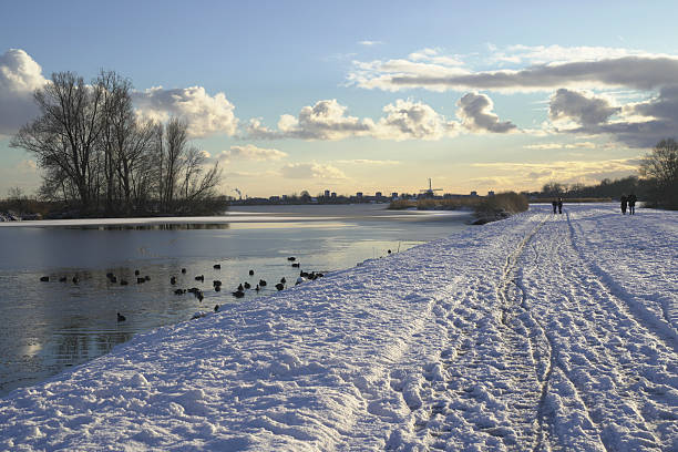 Snow scene by the water