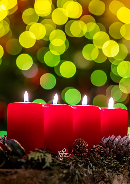 Four candles with christmas decoration