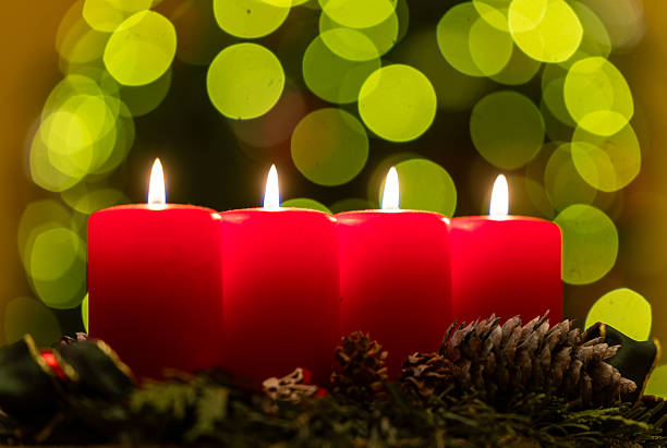Four candles with christmas decoration