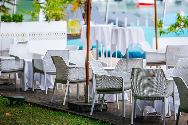 Garden furniture set on the bright green lawn in the backyard.