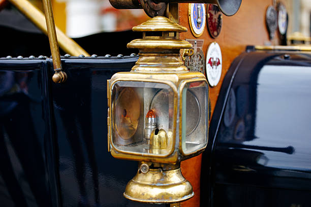Velden, Austria - August 30, 2025: Vintage brass lantern on classic automobile highlights craftsmanship and design at an Oldtimer Festival, creating a nostalgic atmosphere