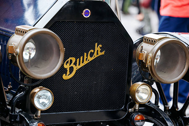 Vintage Elegance: Detailed View of a Classic Car's Chrome Headlight and Iconic Grille - Preserving Automotive History