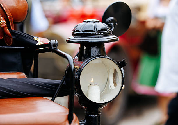 Velden, Austria - August 30, 2025: Vintage car lantern features a candle inside, highlighting classic design elements at an Oldtimer Festival with a nostalgic atmosphere