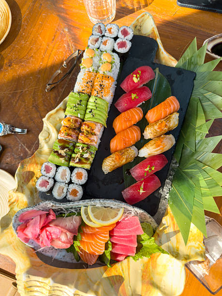 Sushi set on the plate, Fresh variety of rolls in a restaurant, Eastern cuisine, beach club of Thailand