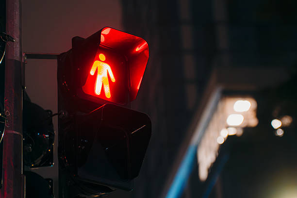 istock Traffic Light Against Downtown Skyscrapers At Night Traffic Light 2255473499