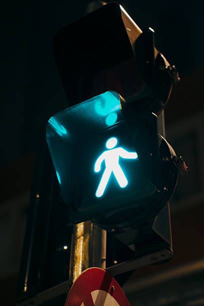 istock Traffic Light Against Downtown Skyscrapers At Night Traffic Light 2255473500