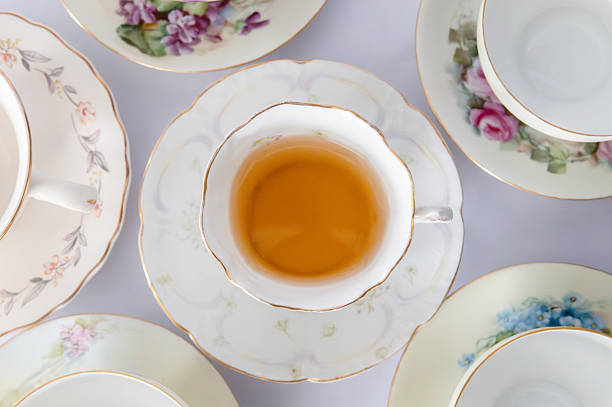 Alice in Wonderland adapted into a childs silly tea party. The March Hare, Mad Hatter and Alice having a tea party. 
