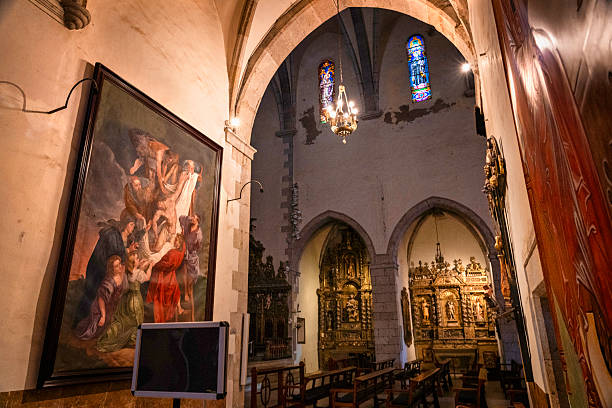 Cadaques, Spain - July 4, 2024:  Interior of the 16th century St. Maria Gothic church that has a massive gold altar  in the tiny fishing village on the Mediterranean Sea, Costa Brava, Catalonia, Spain