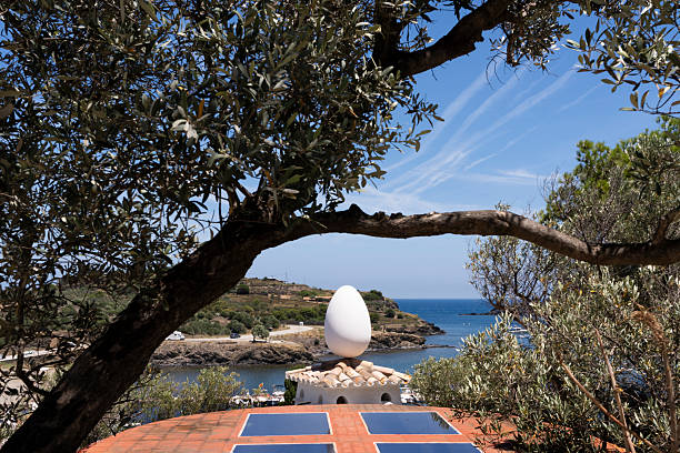 Port lligat, Spain - July 5, 2024:  Egg sculpture at the garden of the summer house of the painter Dali in Portlligat, a small village on the Costa Brava of the Mediterranean Sea, in the municipality of Cadaques, Girona, CataloniaSalvador Dali home where he lived 50 years in the bay of Port Lligat in the small fishing village of Cadaques on the Costa Brava, Girona, Spain