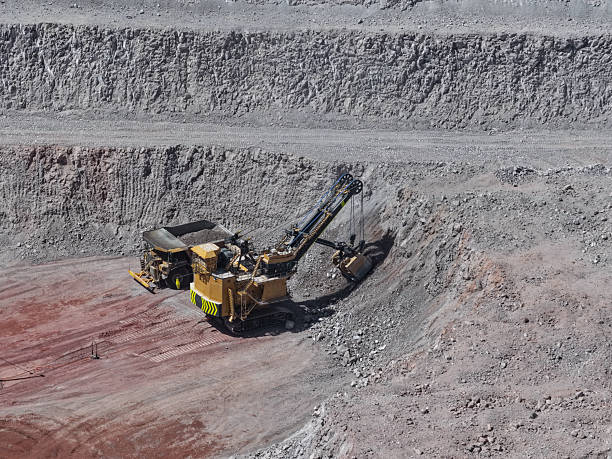 istock Enormous electric shovel in the process of extracting and loading copper ore from an open-pit mine 2255488192