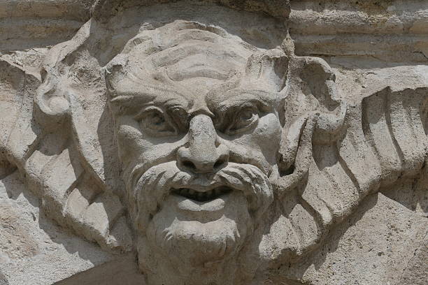 Mascarons, sculpted faces from the 18th-19th centuries adorning the facades of buildings in the city center of Nantes, Loire-Atlantique
